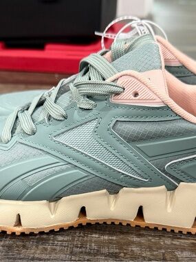 Reebok Women’s Sneaker in Sage Green with Blush Accents